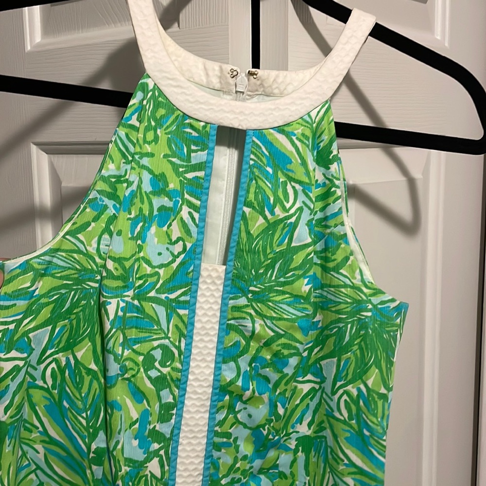 Green and blue floral Lilly dress with white edging.